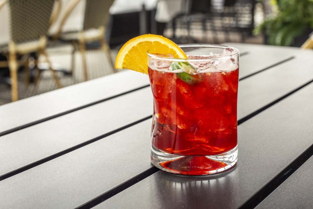 Tucci’s Hot Blooded Cocktail with Maker’s Mark bourbon, blood orange syrup, agave syrup and slice of jalapeno