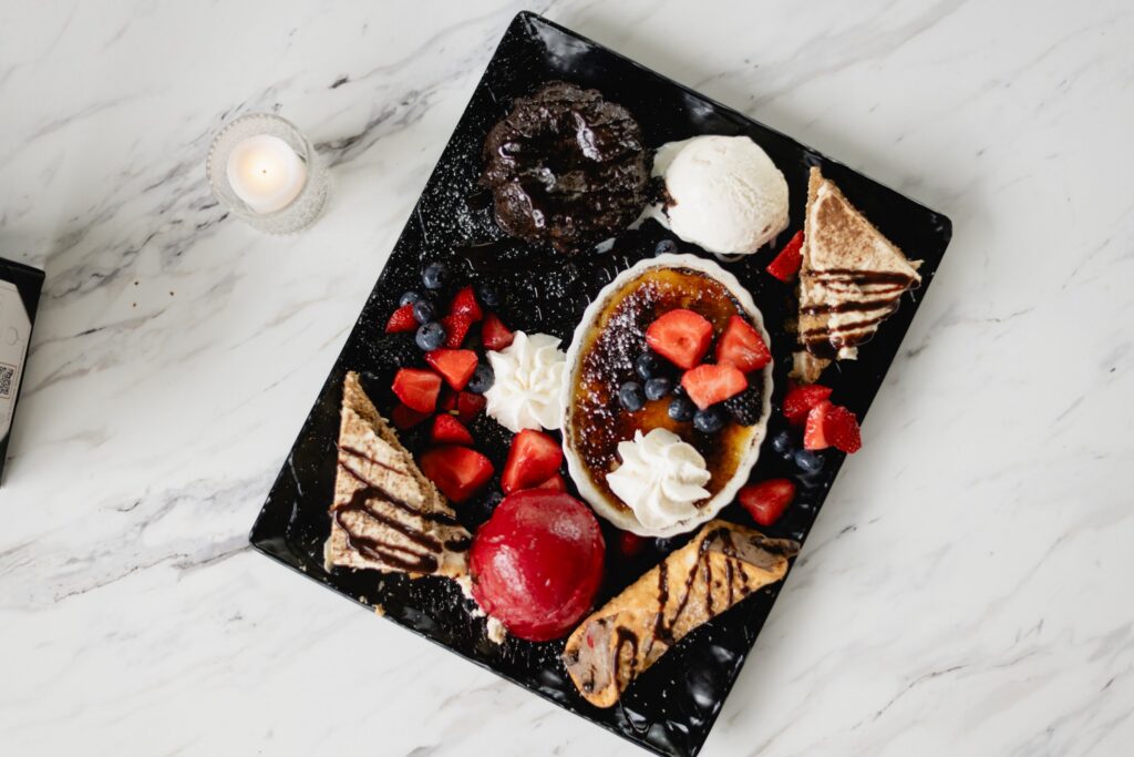 Tucci's dessert board with creme brulee, tiramisu and berries