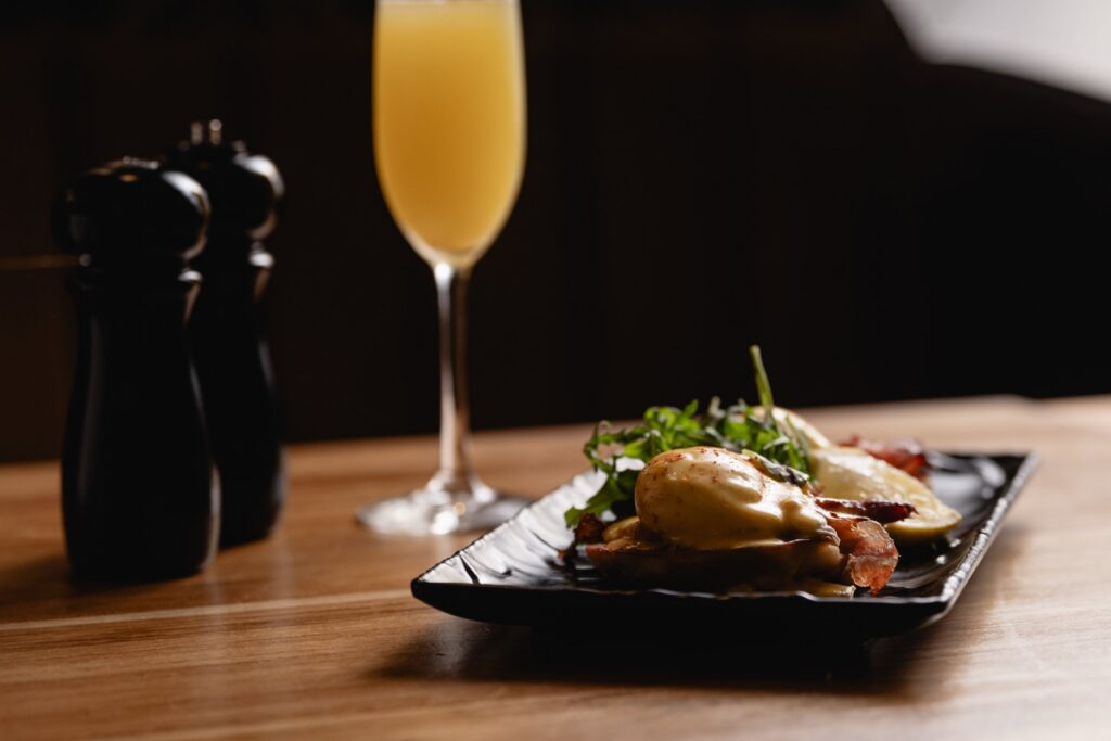 Eggs Benedict with a mimosa at Tucci's weekend brunch