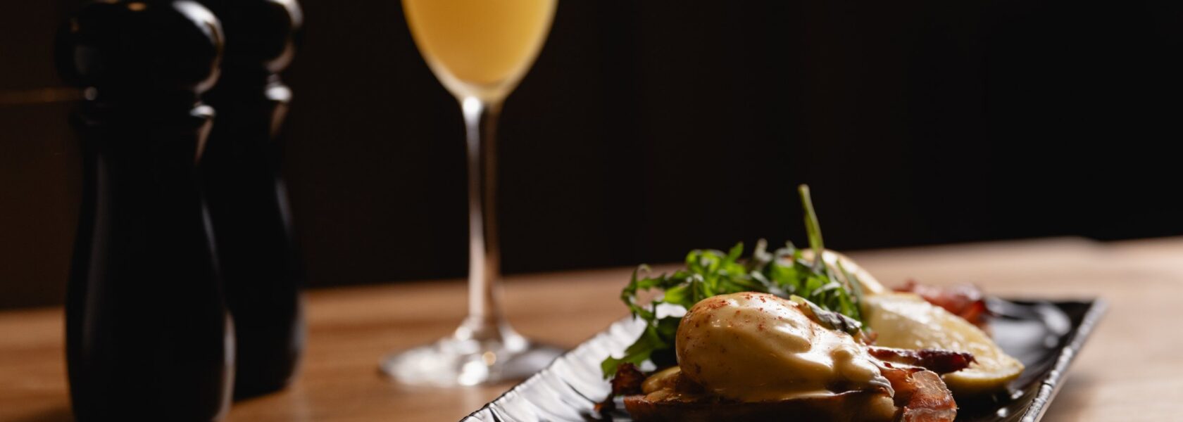 Eggs Benedict with a mimosa at Tucci's weekend brunch