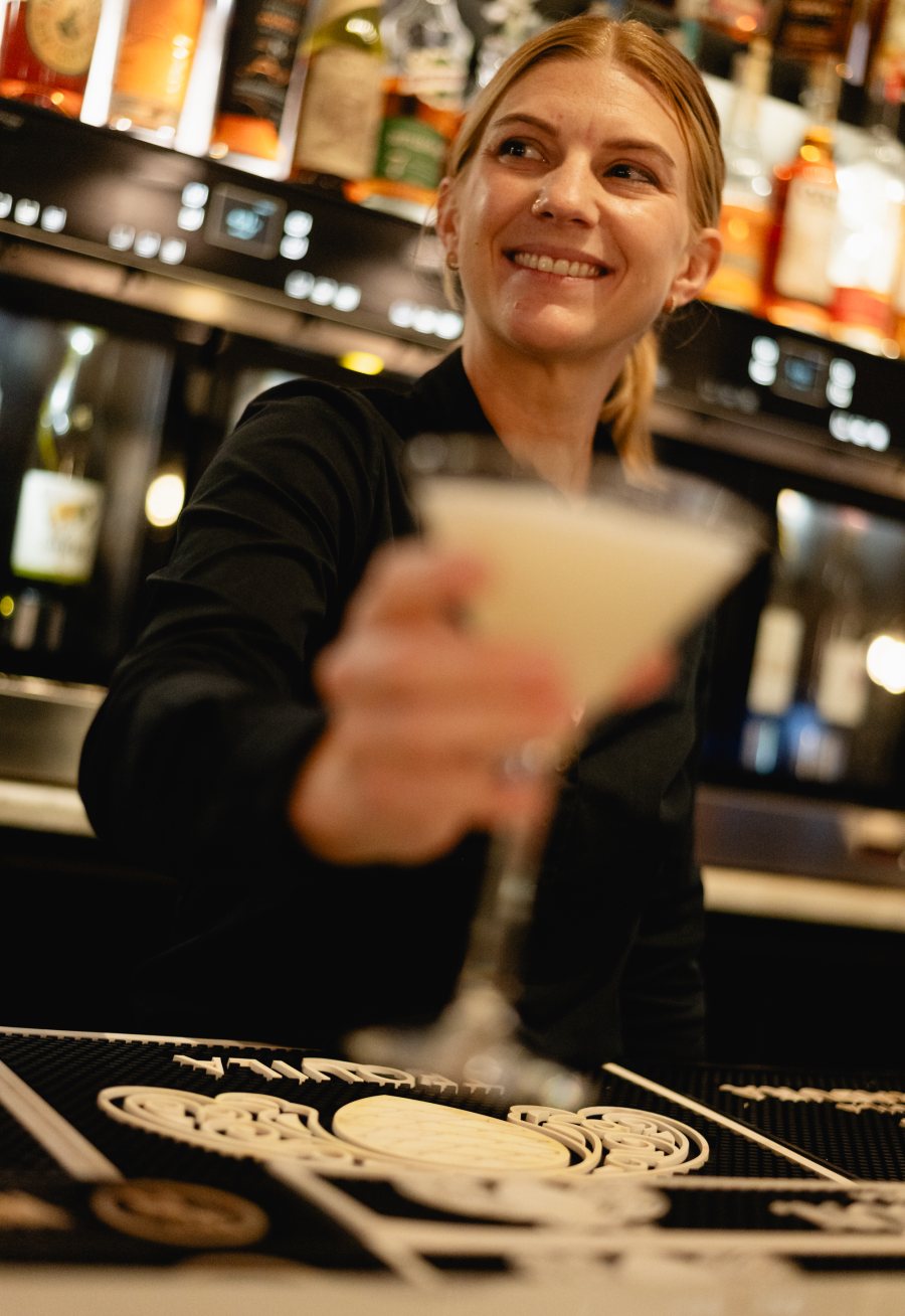 A martini being poured at Tucci's bar